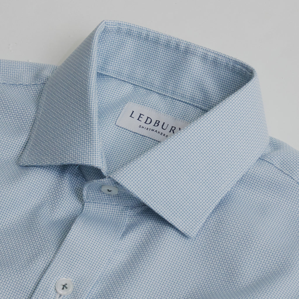 Closeup of the collar of a men's seafoam green non iron dress shirt