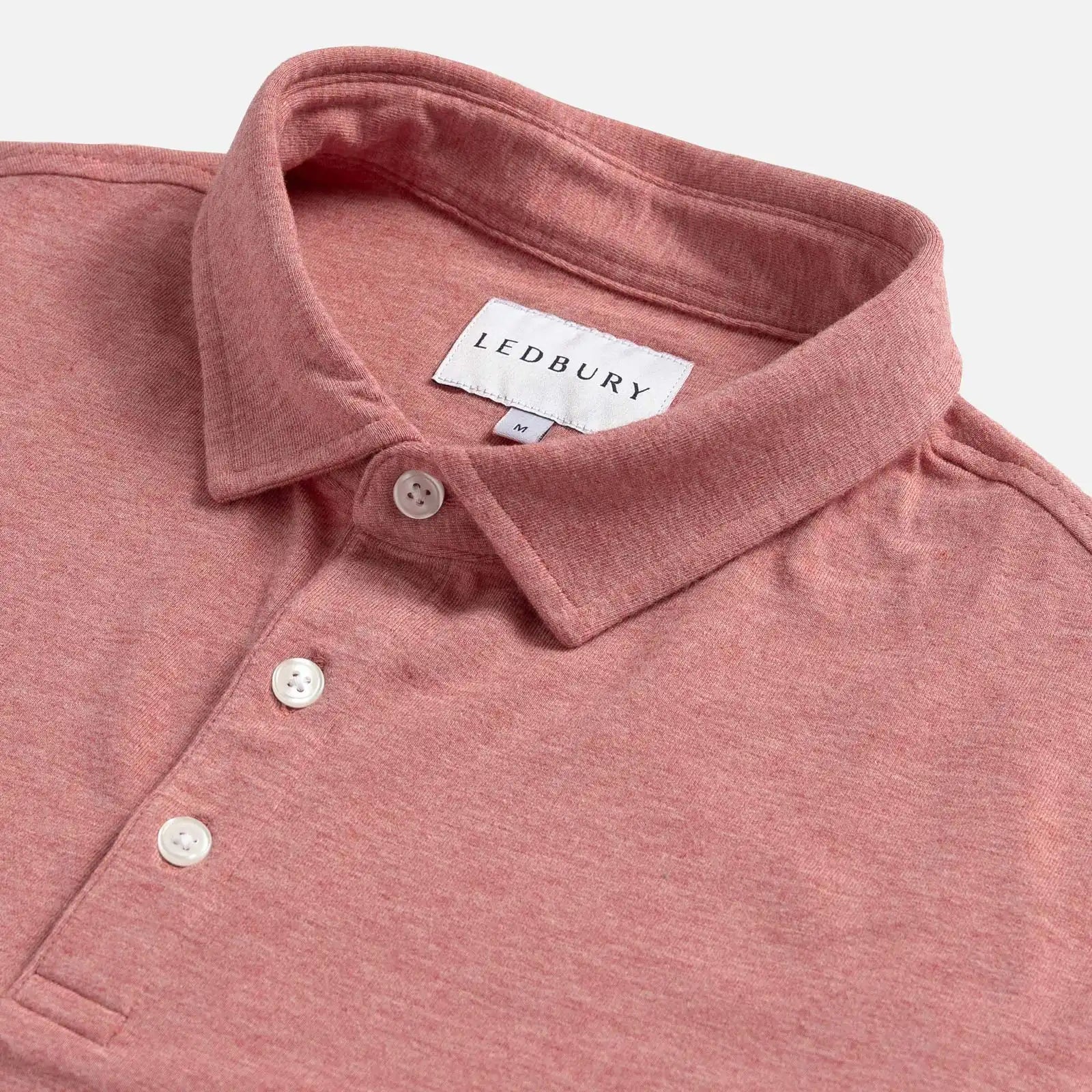 Close-up of the collar on the Ledbury Freeman Knit Custom Polo in Washed Red

