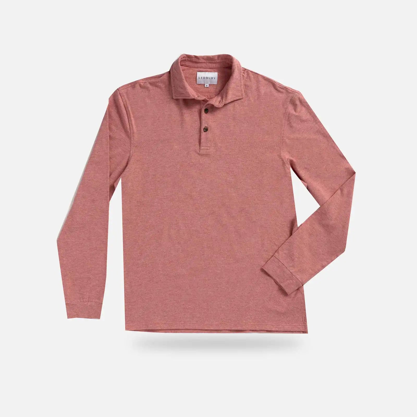 A long-sleeve polo shirt in a heathered red color, featuring a two-button placket and a classic collar, displayed flat against a light gray background.