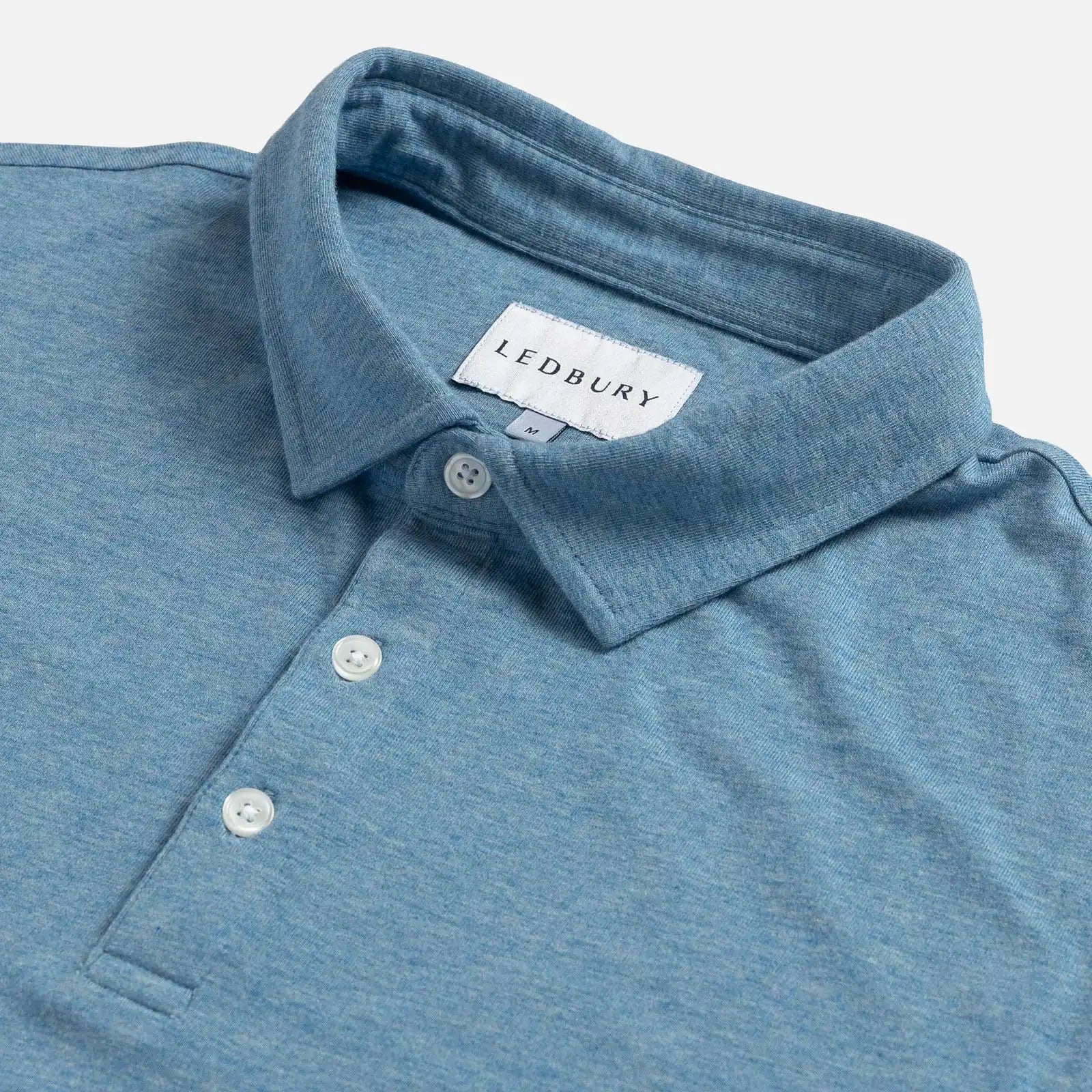 Close-up of the collar on the Ledbury Freeman Knit Custom Polo in Light Blue
