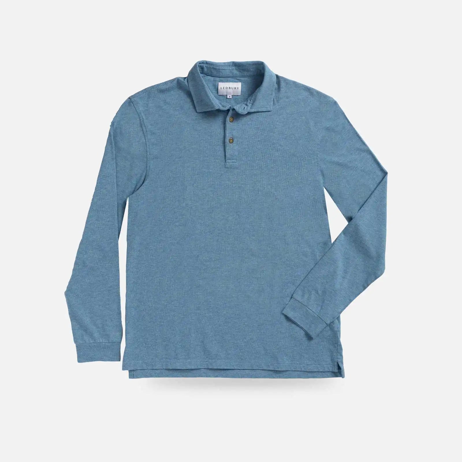 A long-sleeve polo shirt in a heathered slate blue color, laid flat against a light gray background.