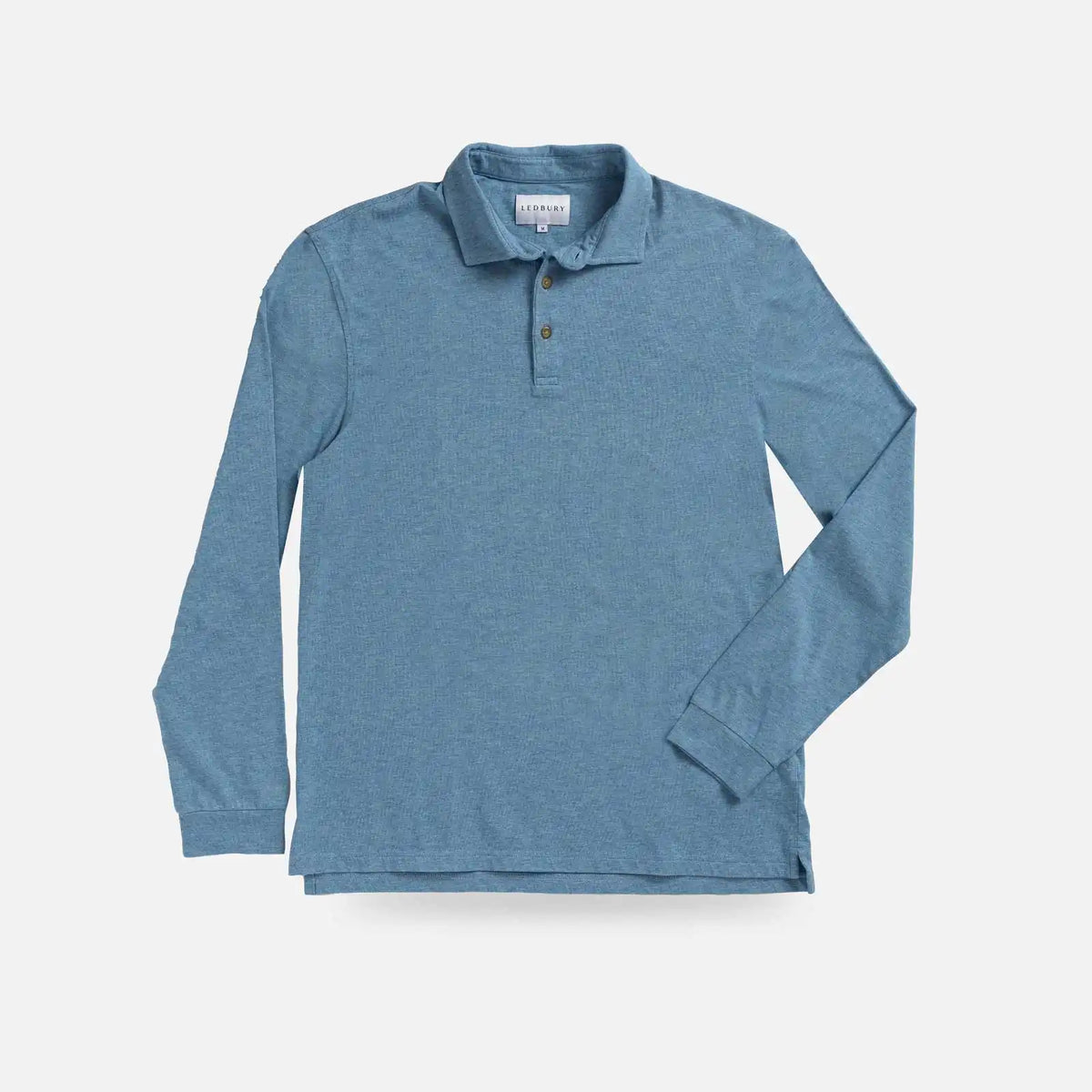 A long-sleeve polo shirt in a heathered slate blue color, laid flat against a light gray background.