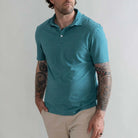 Model wearing the Ledbury Freeman Knit Custom Polo in Teal
