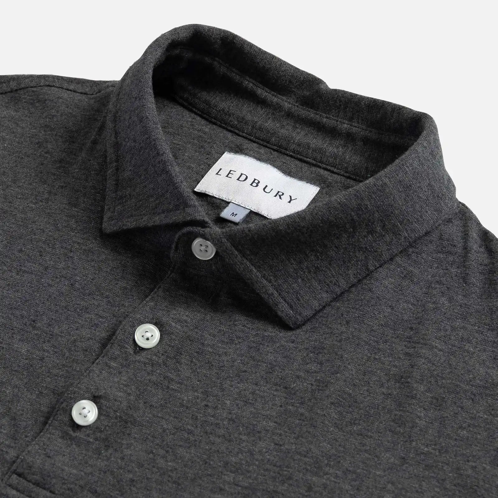 Close-up of the collar on the Ledbury Freeman Knit Custom Polo in Charcoal Grey
