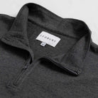 Close-up of quarter-zip collar and Ledbury label on Freeman Sport Quarter Zip in Charcoal Grey
