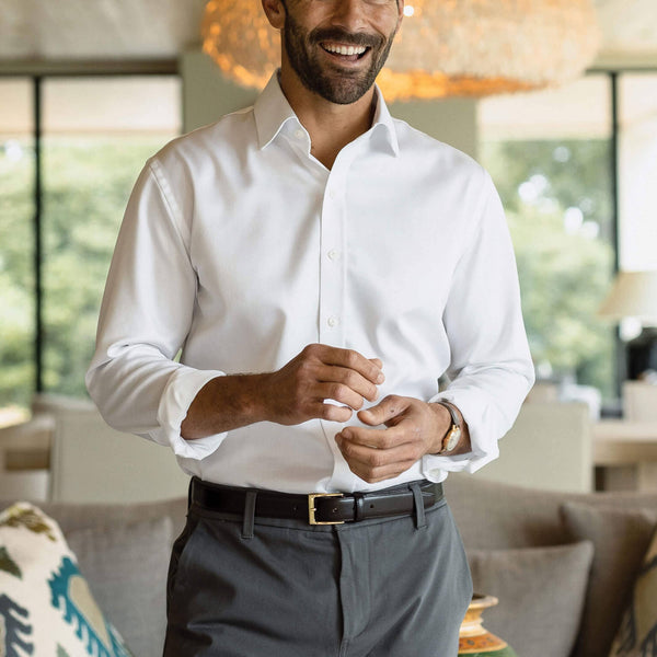 Man wearing white non-iron dress shirt - wrinkle-free custom fit business shirt