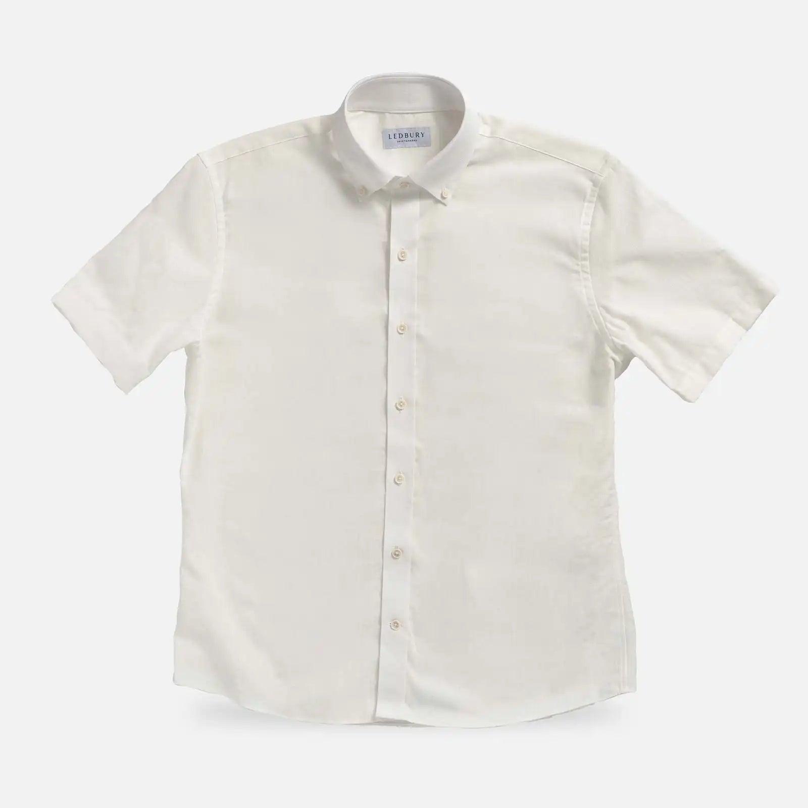 Cream Sandoval Oxford Chambray short sleeve shirt laid flat — slub cotton fabric detail, Ledbury