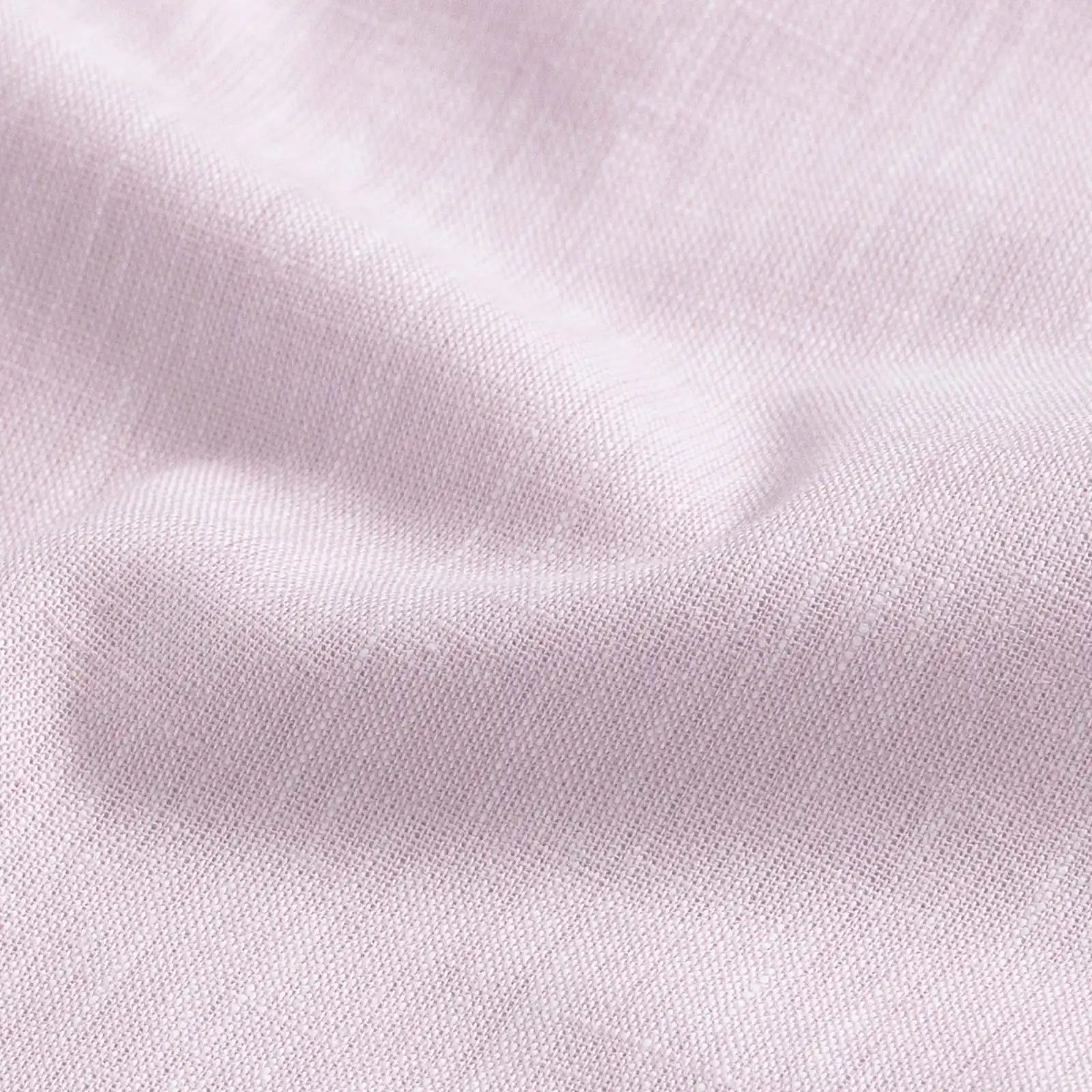 Close-up of slub cotton oxford chambray fabric — subtle heathered texture on the Pink Sandoval