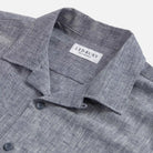 Camp collar detail on the Navy Blue Sandoval — open, flat-lying collar in slub cotton chambray