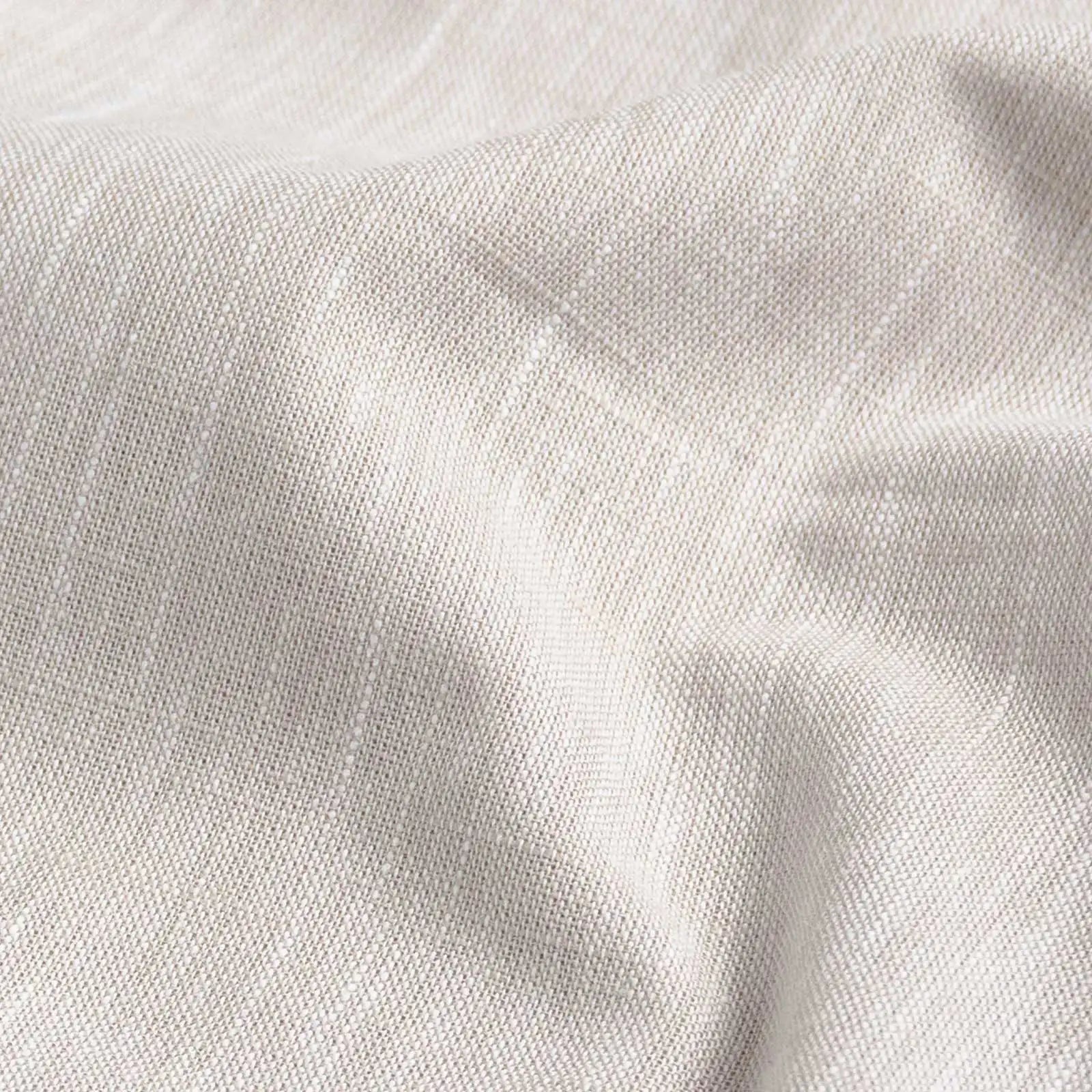 Ecru slub cotton oxford chambray fabric close-up - textured heathered weave