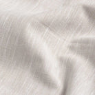 Ecru slub cotton oxford chambray fabric close-up - textured heathered weave