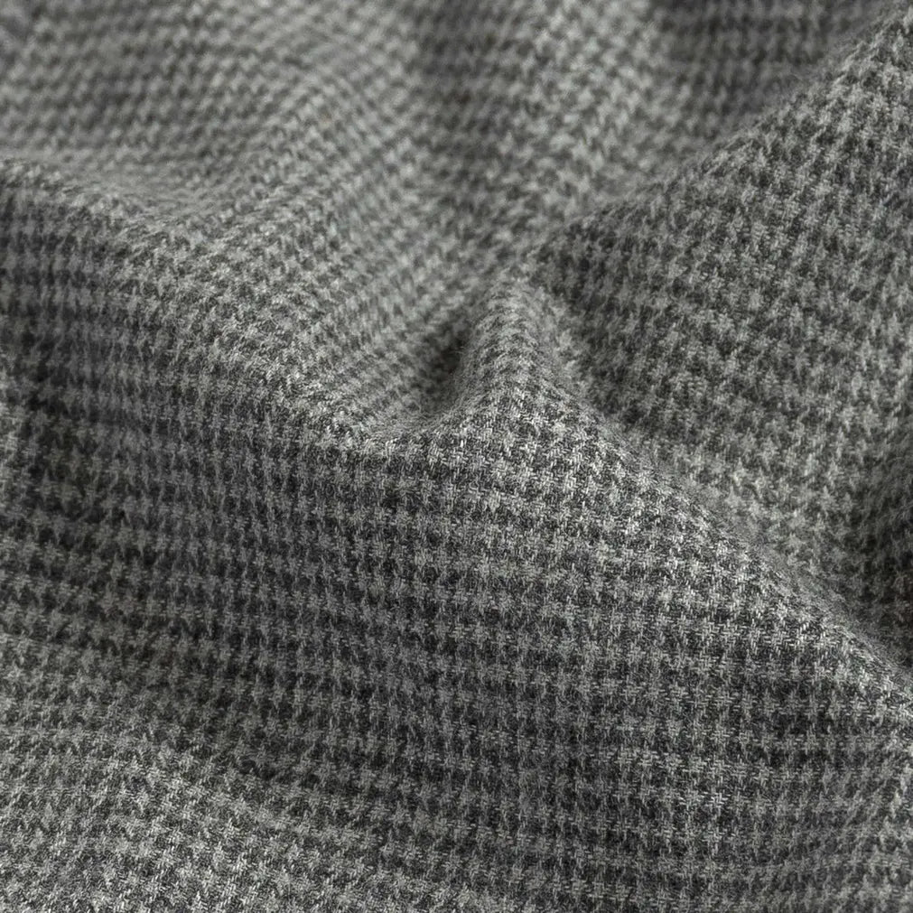 Brushed twill fabric close-up - grey houndstooth pattern texture