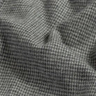 Brushed twill fabric close-up - grey houndstooth pattern texture