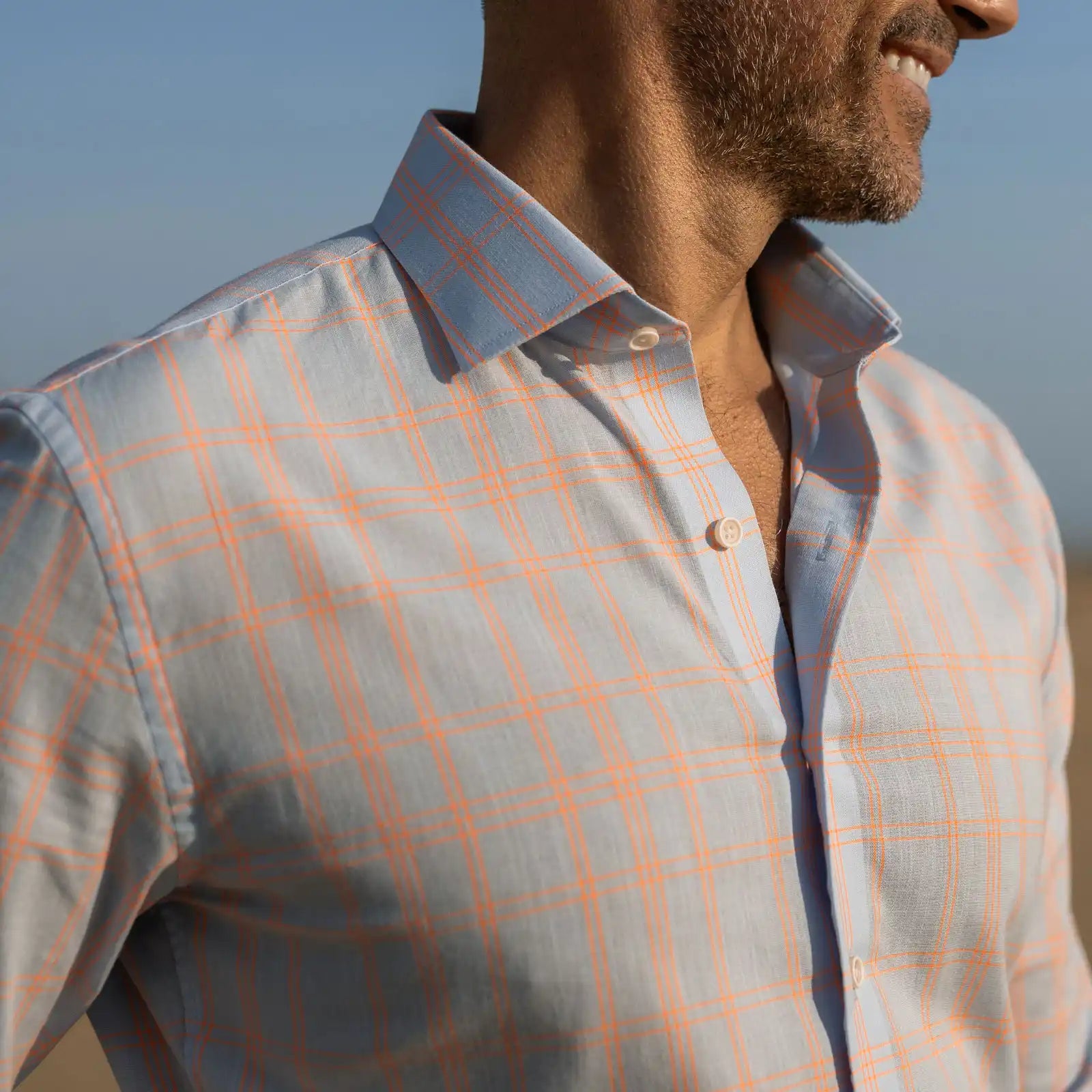 Close-up of man wearing the Ledbury Light Blue Torello Check custom shirt