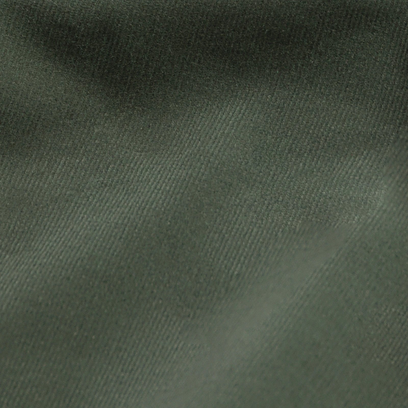 A close-up of dark olive green fabric with a fine ribbed texture and soft folds.