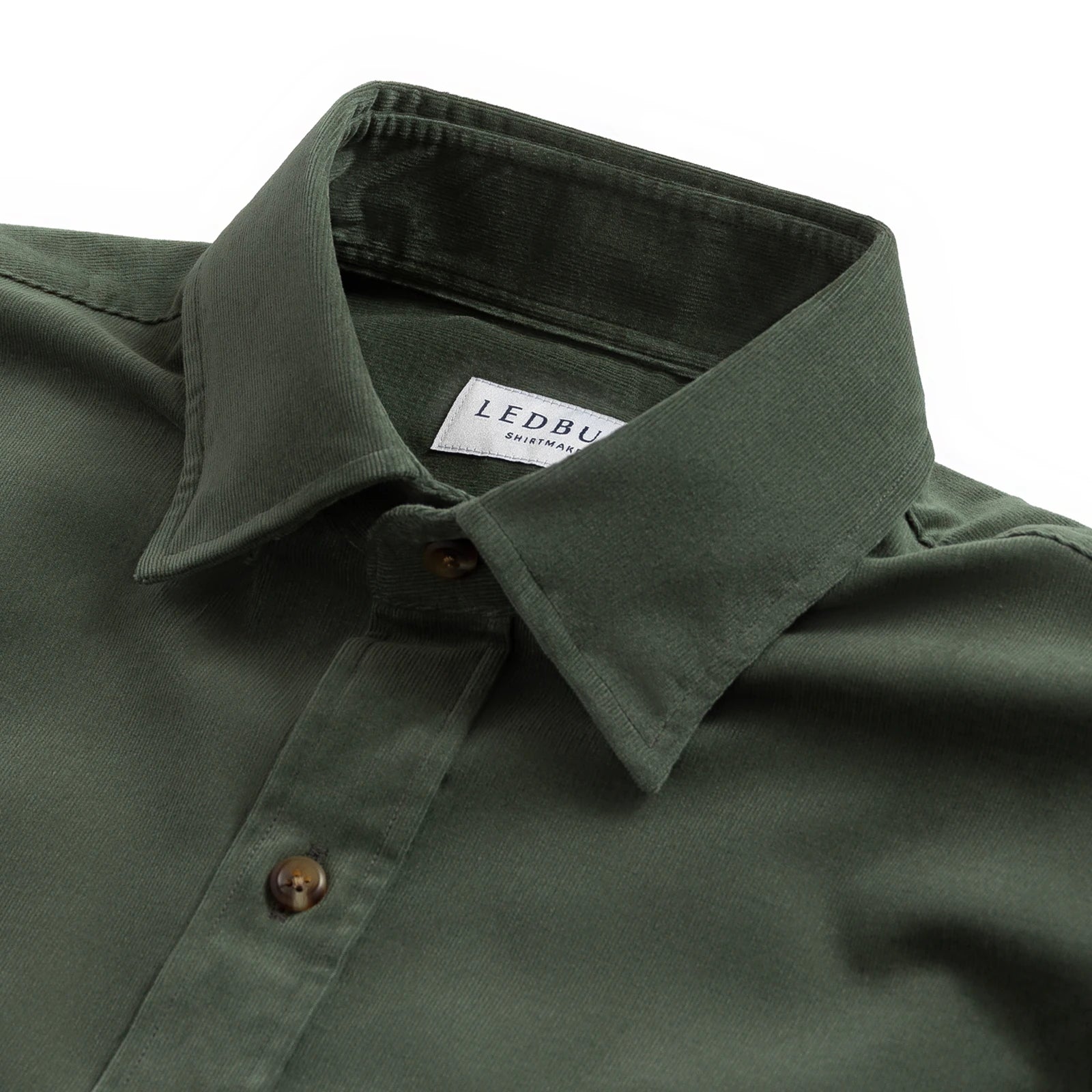 Close-up of a dark olive green button-down shirt collar with a visible Ledbury label, set against a plain white background.