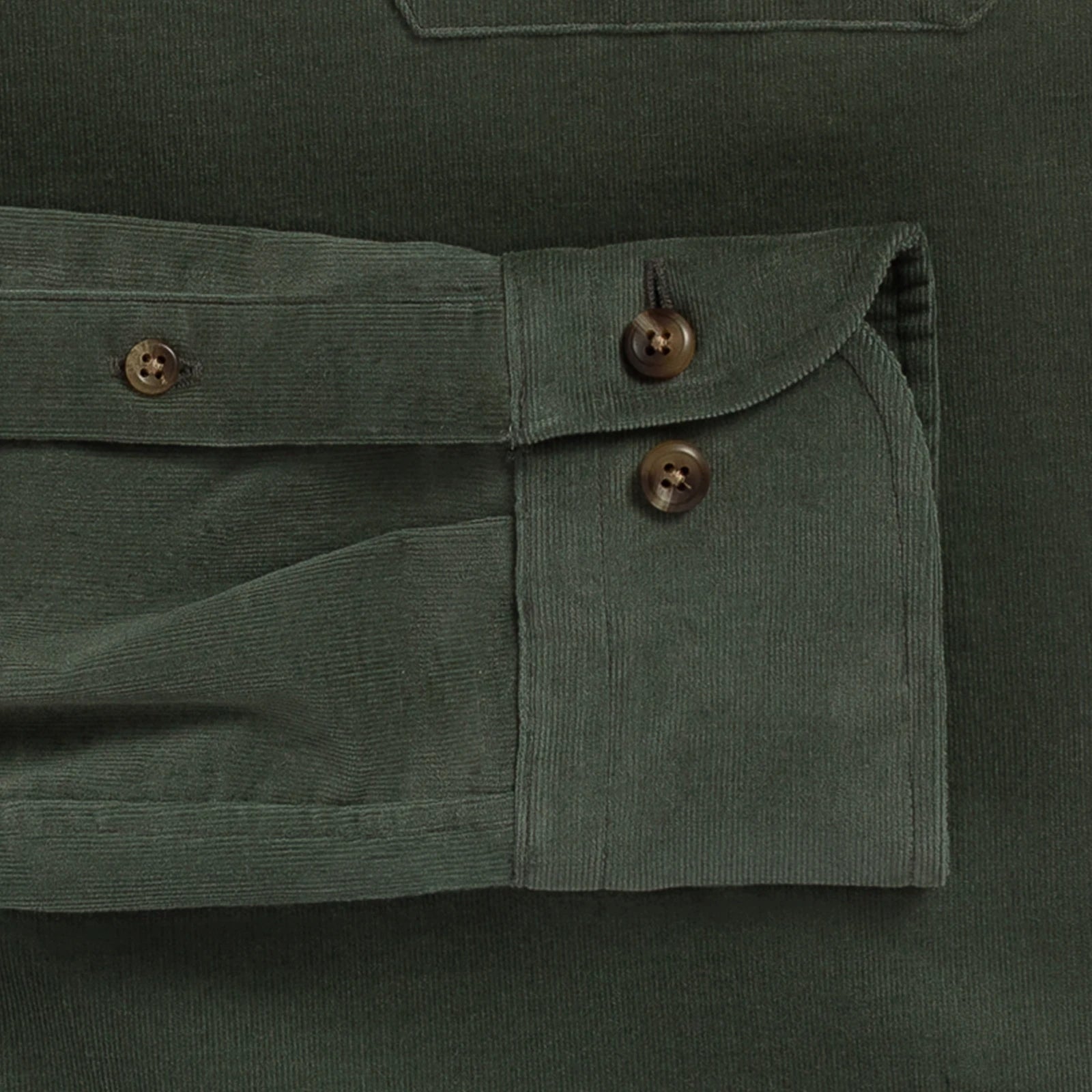 Close-up detail of an olive green corduroy shirt pocket with buttoned flap and dark brown buttons.