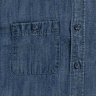 Blue denim utility shirt chest pocket detail - double button-through design