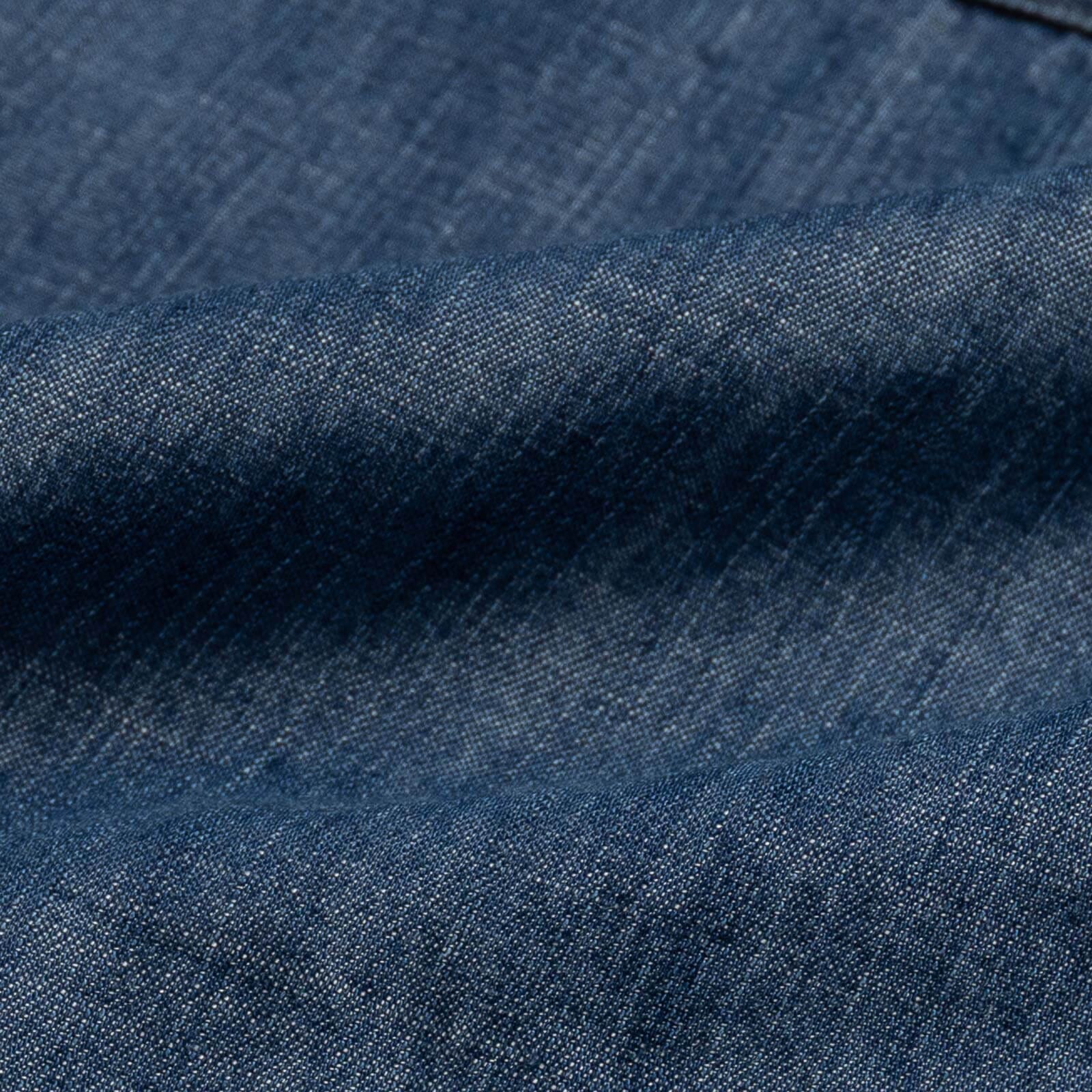 Blue Easton denim fabric close-up - faded indigo Tencel texture