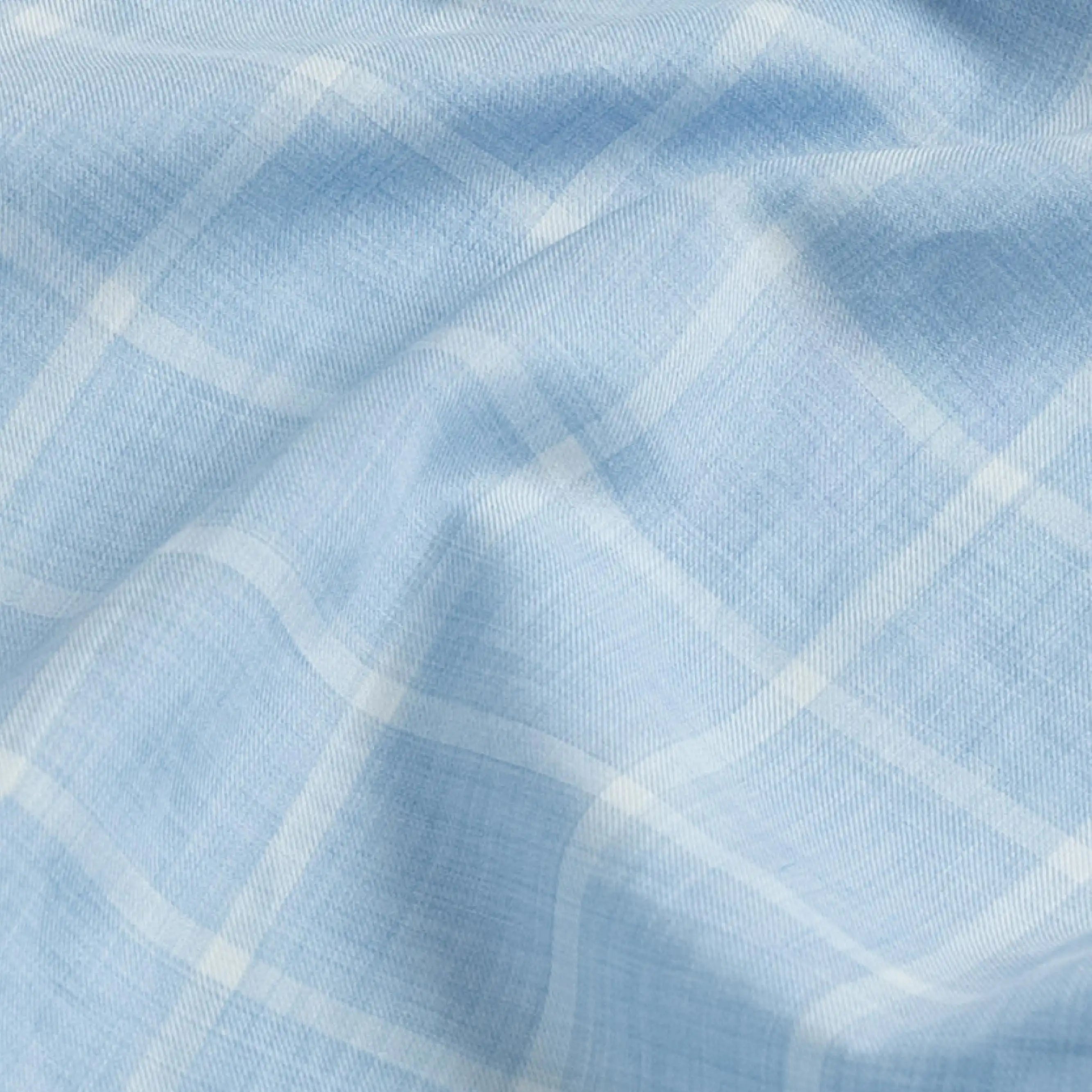 Close-up fabric detail of the blue Albini Pritchard Italian checkered dress shirt