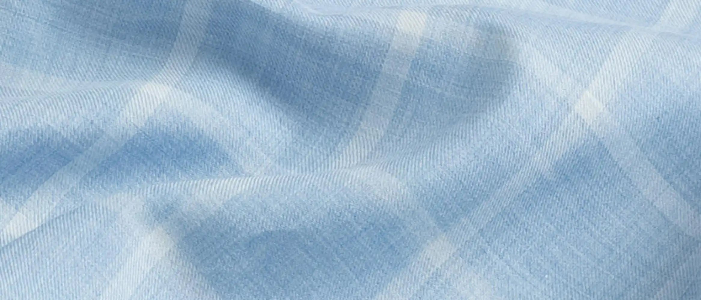 Close-up fabric detail of the blue Albini Pritchard Italian checkered dress shirt