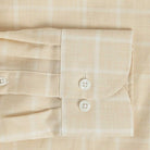 Sleeve detail of an Italian Albini light butter yellow and white checkered button down shirt