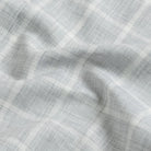 Close-up fabric detail of the grey Albini Pritchard Italian checkered dress shirt