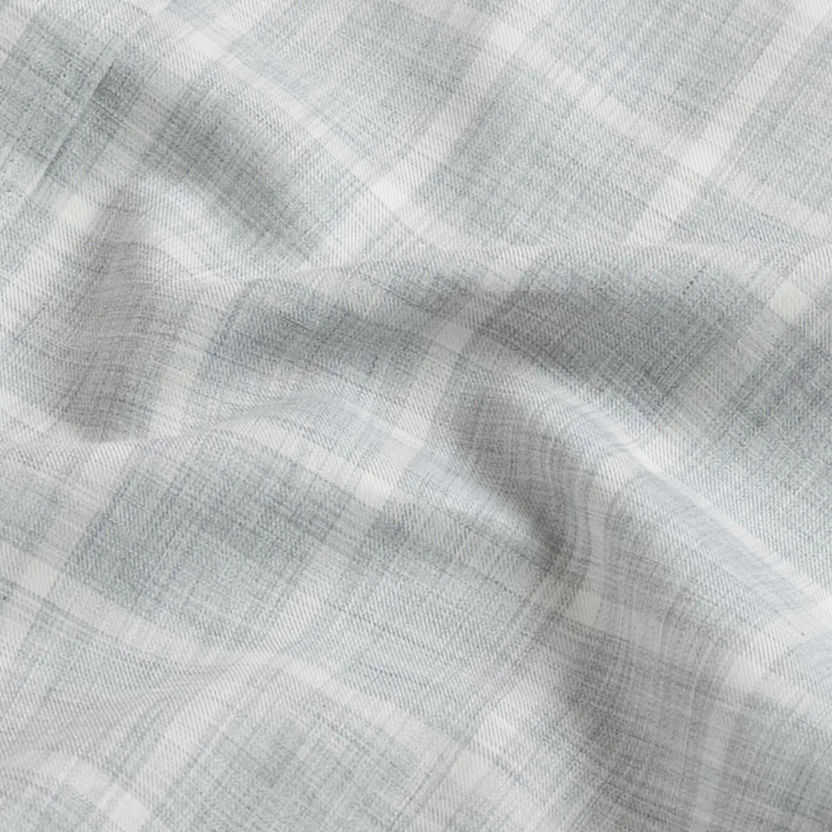Close-up fabric detail of the grey Albini Pritchard Italian checkered dress shirt