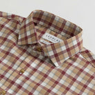 Collar detail showing Italian woven Albini Calloway plaid craftsmanship