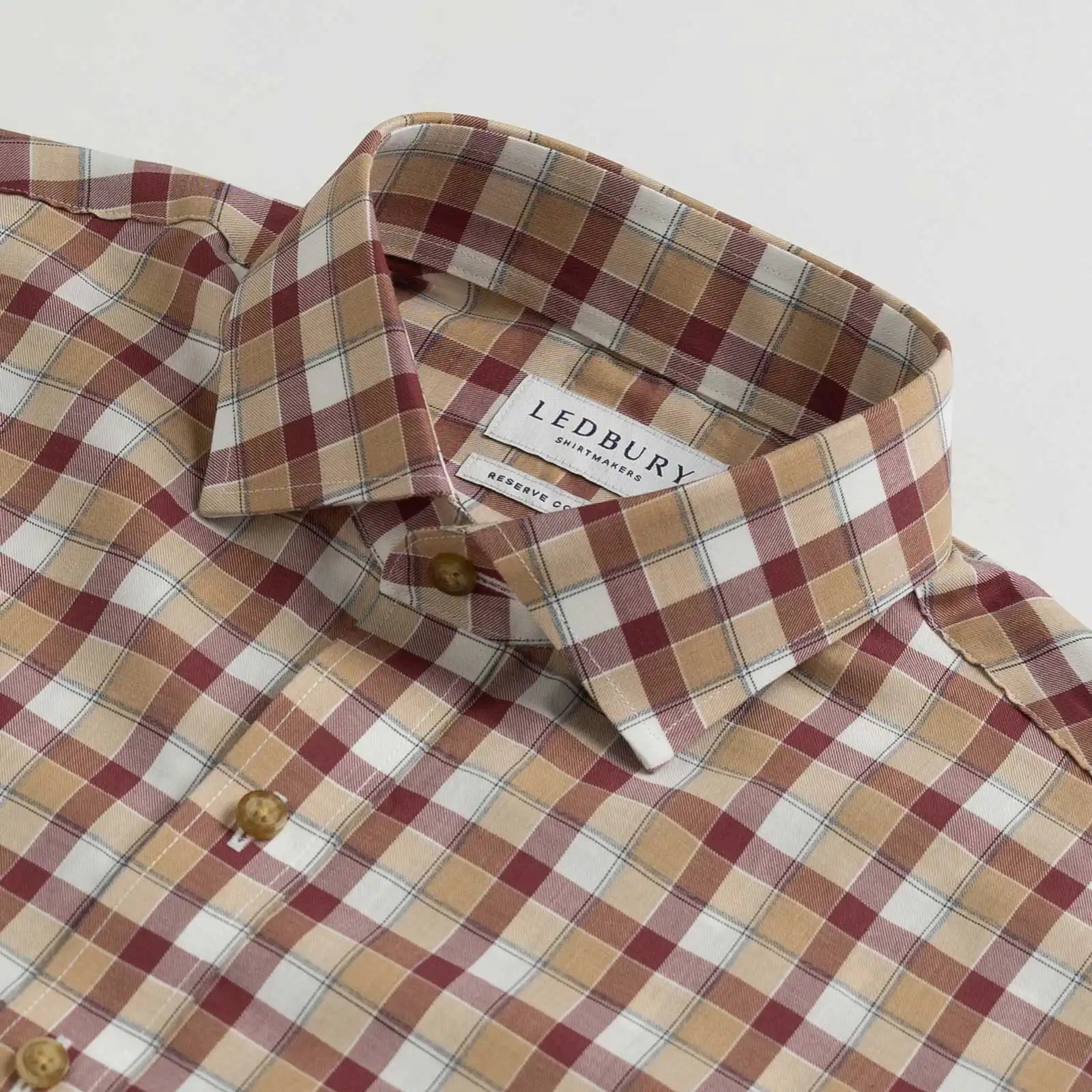 Collar detail showing Italian woven Albini Calloway plaid craftsmanship