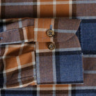 Orange and navy plaid flannel custom shirt cuff and sleeve detail