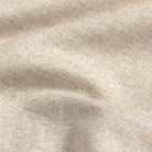 Close-up of an oatmeal fabric with a subtle herringbone pattern