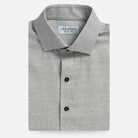 Grey heathered button down shirt with dark buttons flay lay