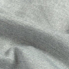 Close-up of gray fabric with a subtle herringbone pattern