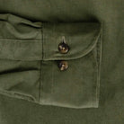 Olive green corduroy shirt cuff and sleeve construction detail