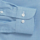 Bright blue dobby dress shirt cuff and sleeve detail