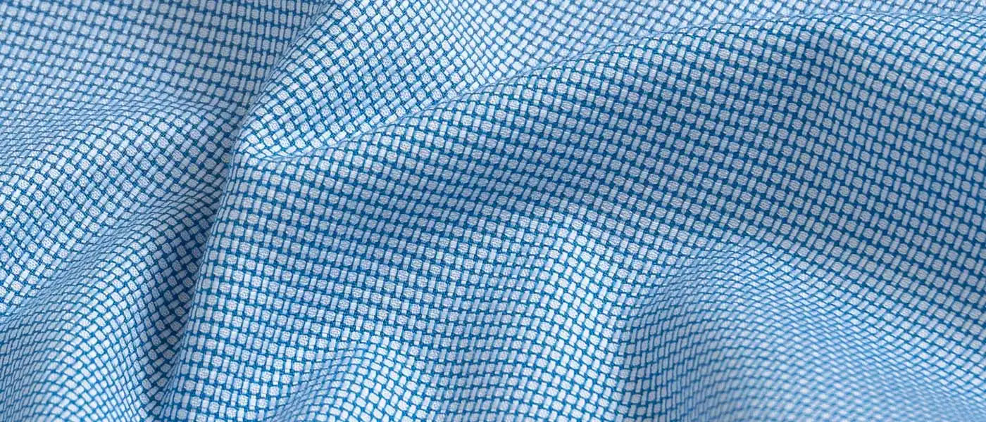 Close up of bright blue dobby textured fabric
