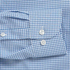 Blue check dress shirt cuff and sleeve construction detail