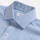 Close-up of a light blue and white striped dress shirt collar by Ledbury