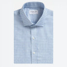 A folded light blue and white checkered dress shirt by Ledbury, featuring a classic collar, white buttons, and a clean white background.