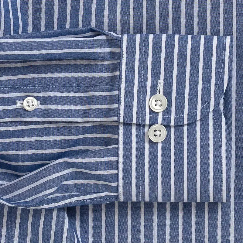Close-up of a blue and white striped dress shirt showing the buttoned cuff and front placket fabric.