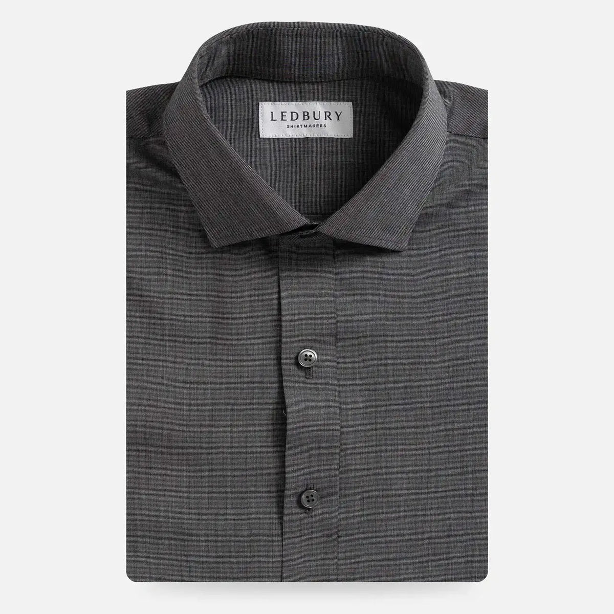 A folded dark gray textured dress shirt with a pointed collar and button-down front, shown on a light gray background. The inner neck label reads LEDBURY.