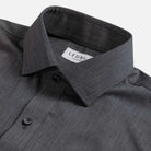 Close-up of a dark gray textured dress shirt collar with a visible LEDBURY brand label on a light gray background.