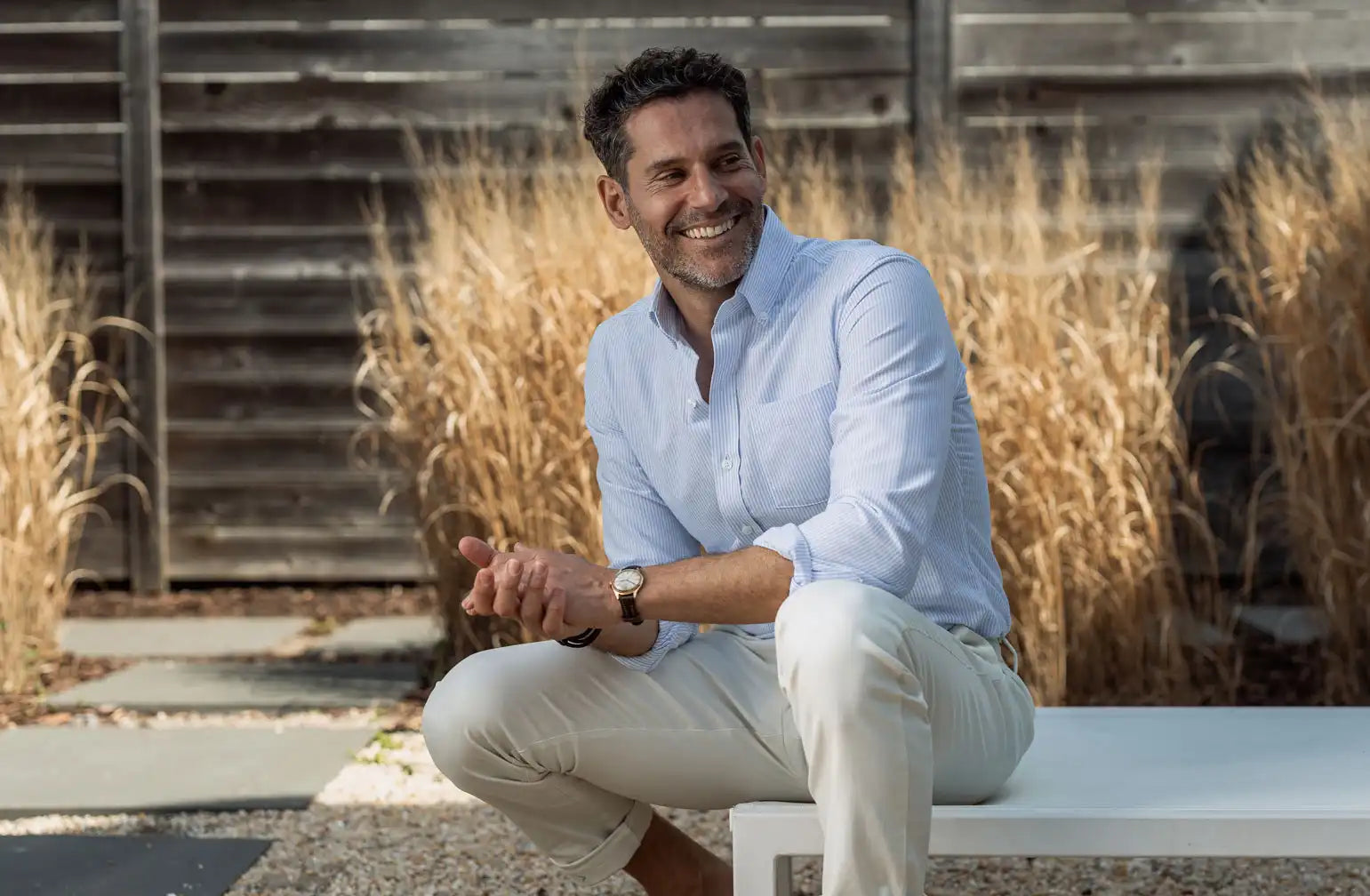 Model wearing a mens light blue striped oxford shirt by Ledbury