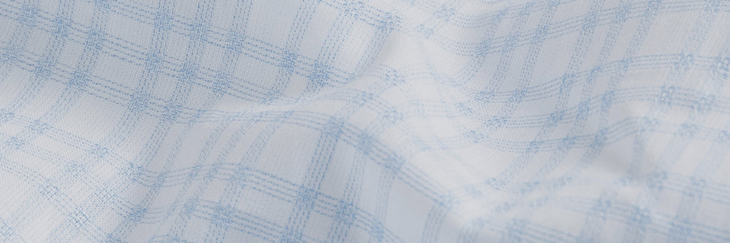 Fabric close up of the light blue and white Ellis plaid custom shirt.