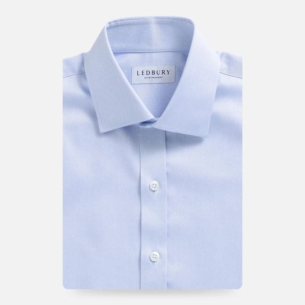 Light blue non-iron dress shirt flat lay - wrinkle-free custom fit shirt